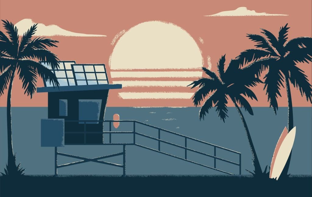 A sunset scene in California, with solar panels on a lifeguard hut