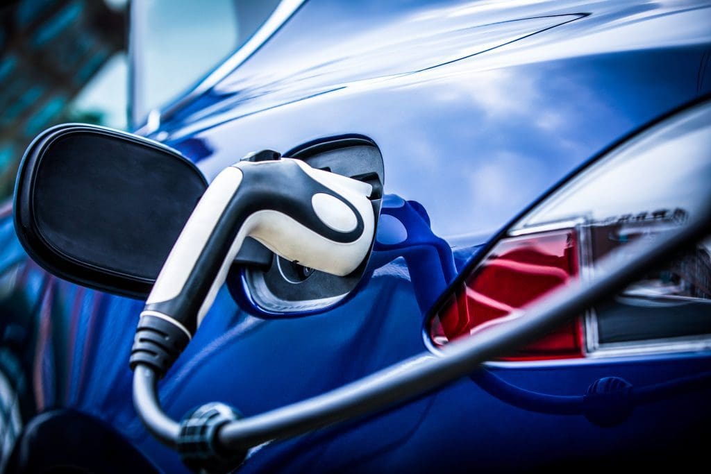 An electric vehicle at a charging station.