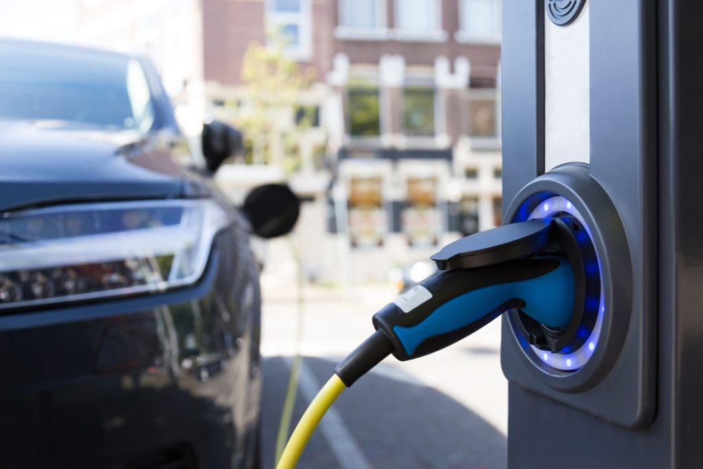 Electric cars pass the tipping point to mass adoption in 31 countries 1 An electric vehicle charging station