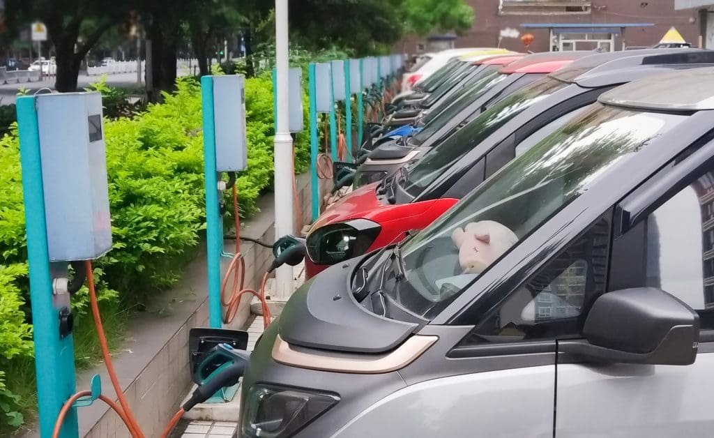 In numbers: How the rise of electric vehicles is curbing oil demand 1 Electric vehicles plugged in at charging stations