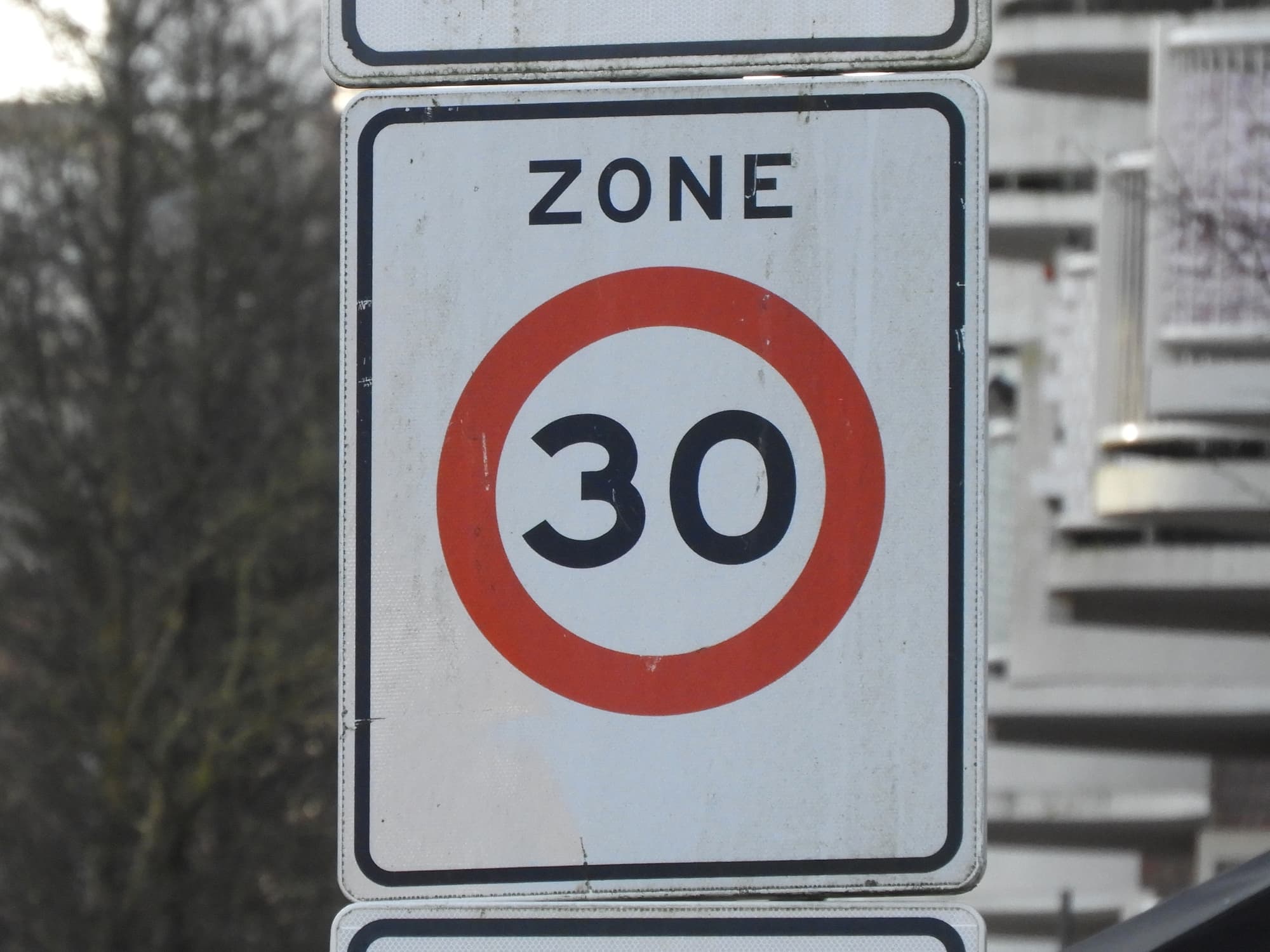 A traffic sign in the city of Amsterdam, the Netherlands, saying the speed limit is 30 kilometres an hour. This is the new speed limit in the whole city.