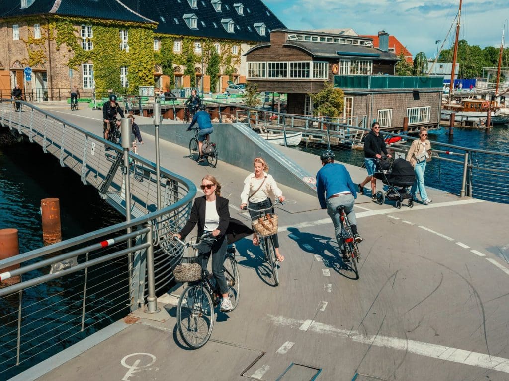 Copenhagen now rewards 'climate-friendly' tourists by giving them free experiences 3 Commuting by bicycle in Copenhagen, which is one of the world's most sustainable cities and which is now encouraging tourists to contribute to green efforts.