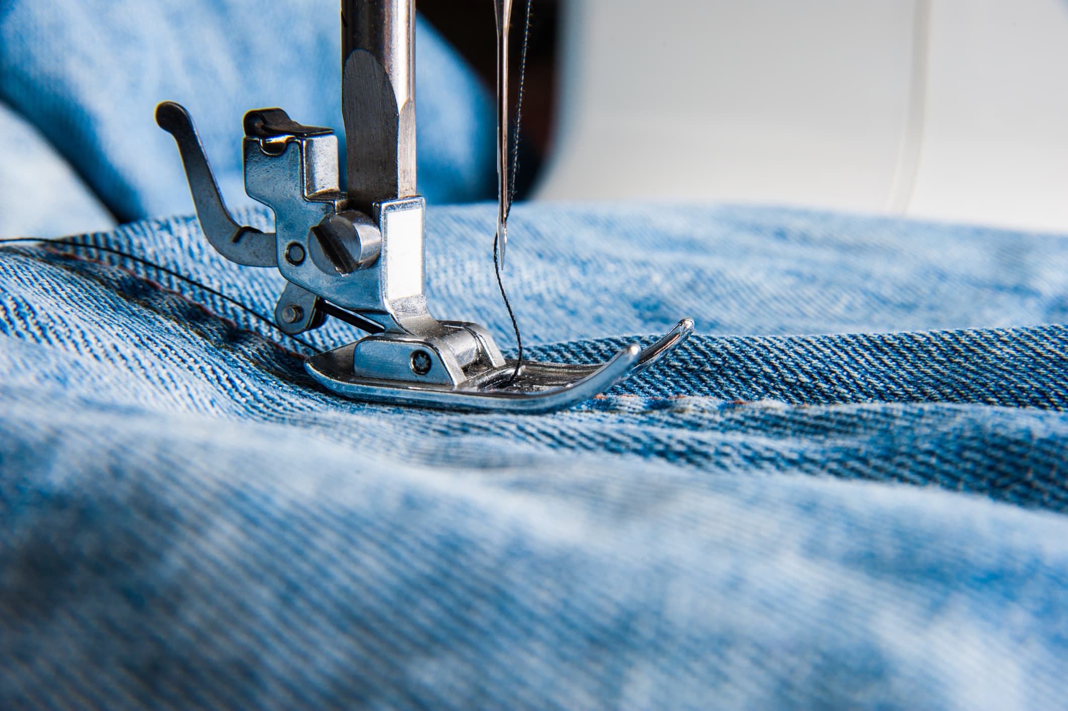 A pair of old jeans being repurposed.