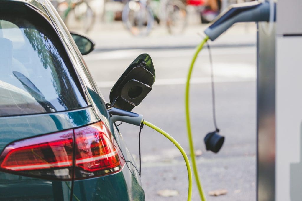 Photo of an electric vehicle at a charging station.