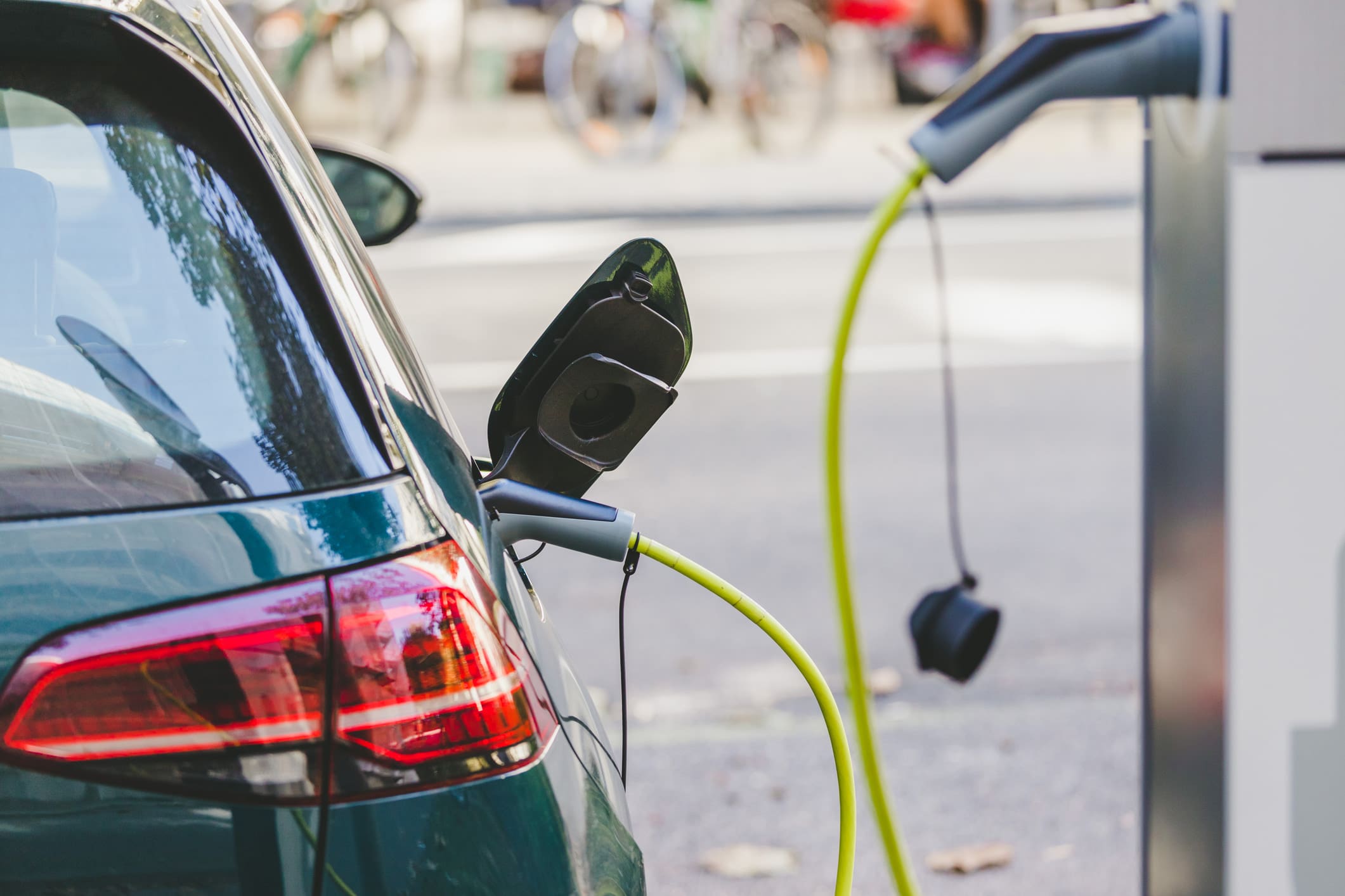 Photo of an electric vehicle at a charging station.