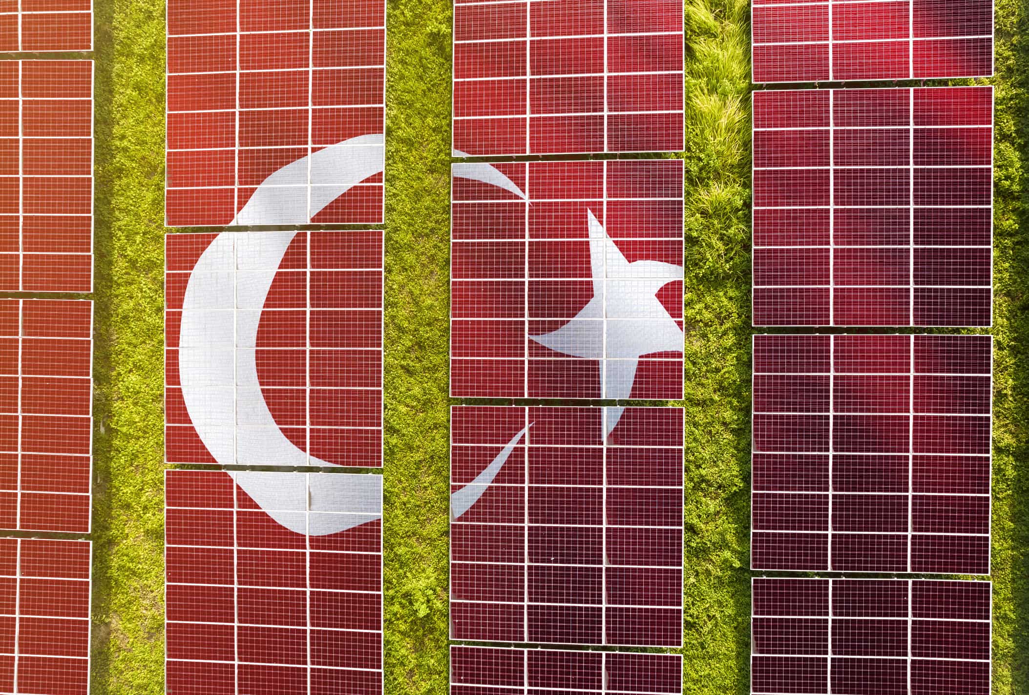 Solar farm superimposed with flag of Turkey.