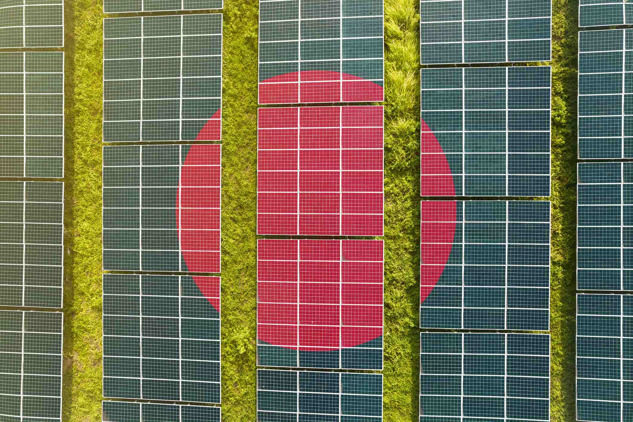 The flag of Bangladesh superimposed over a solar farm.